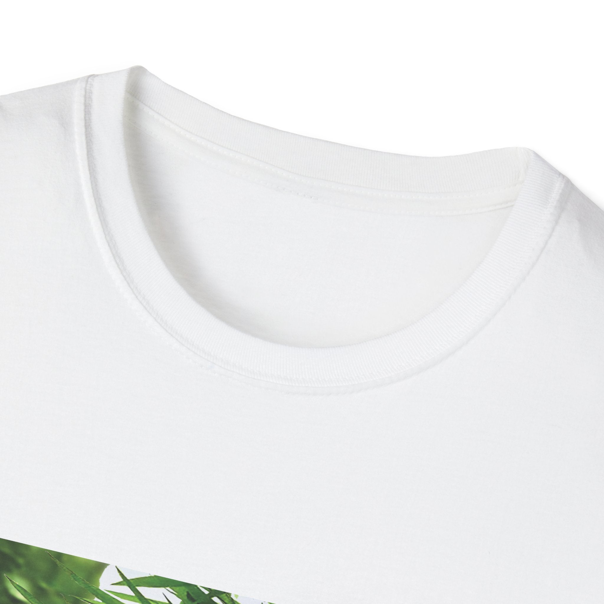 Close-up of a white t-shirt with a green leaf design on a white background