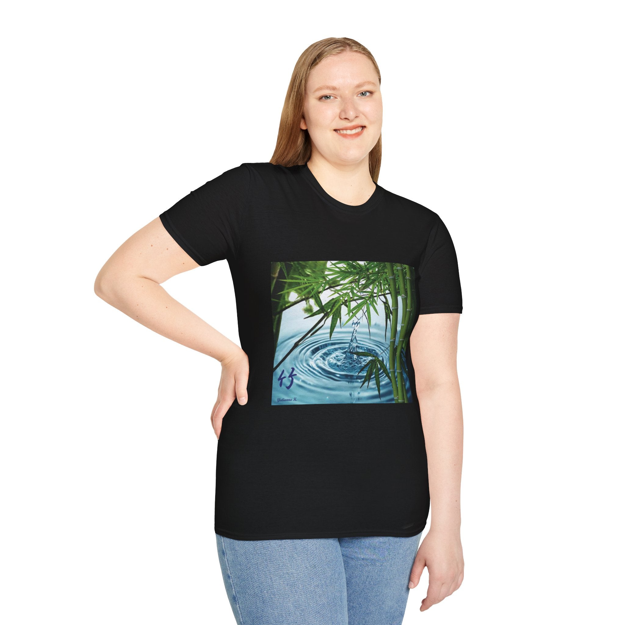 Female wearing a black t-shirt with a nature-themed design on a white background