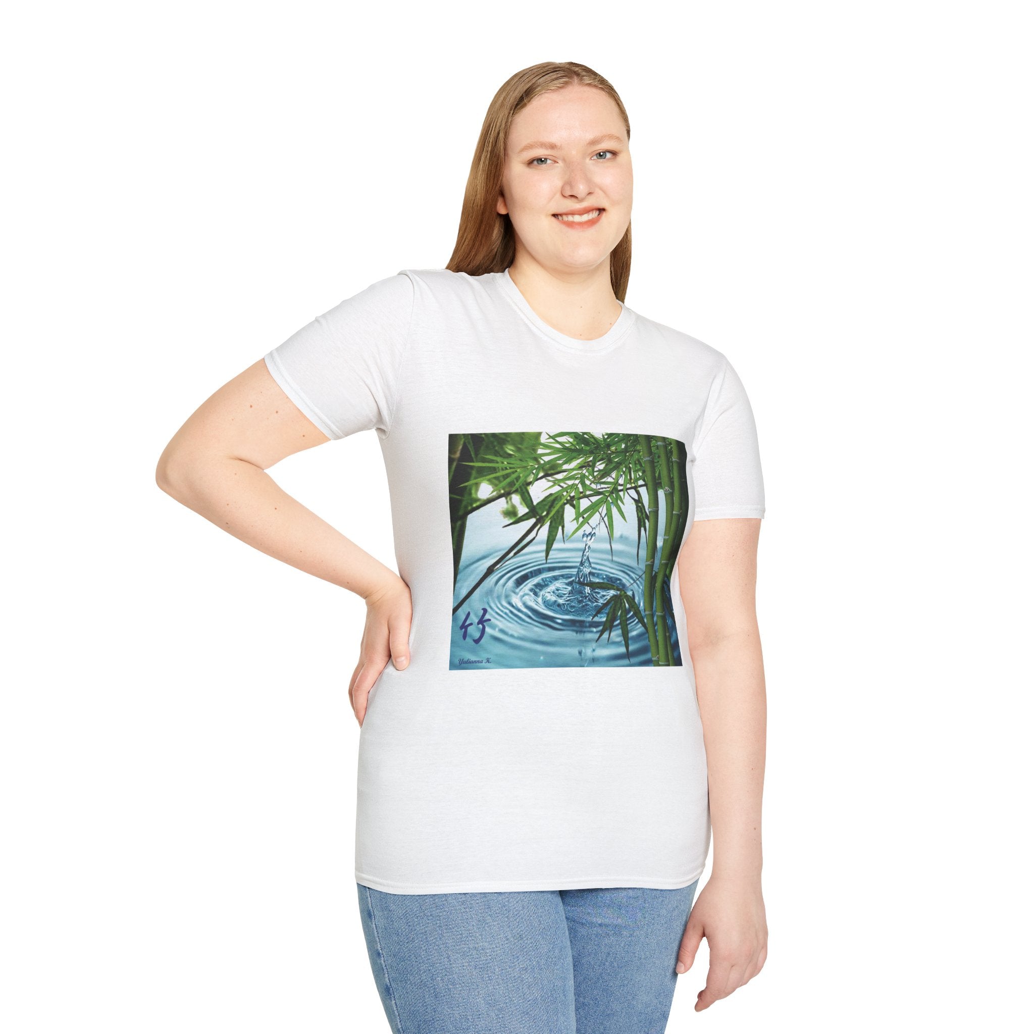 Female wearing a white t-shirt with a nature graphic design on a plain background