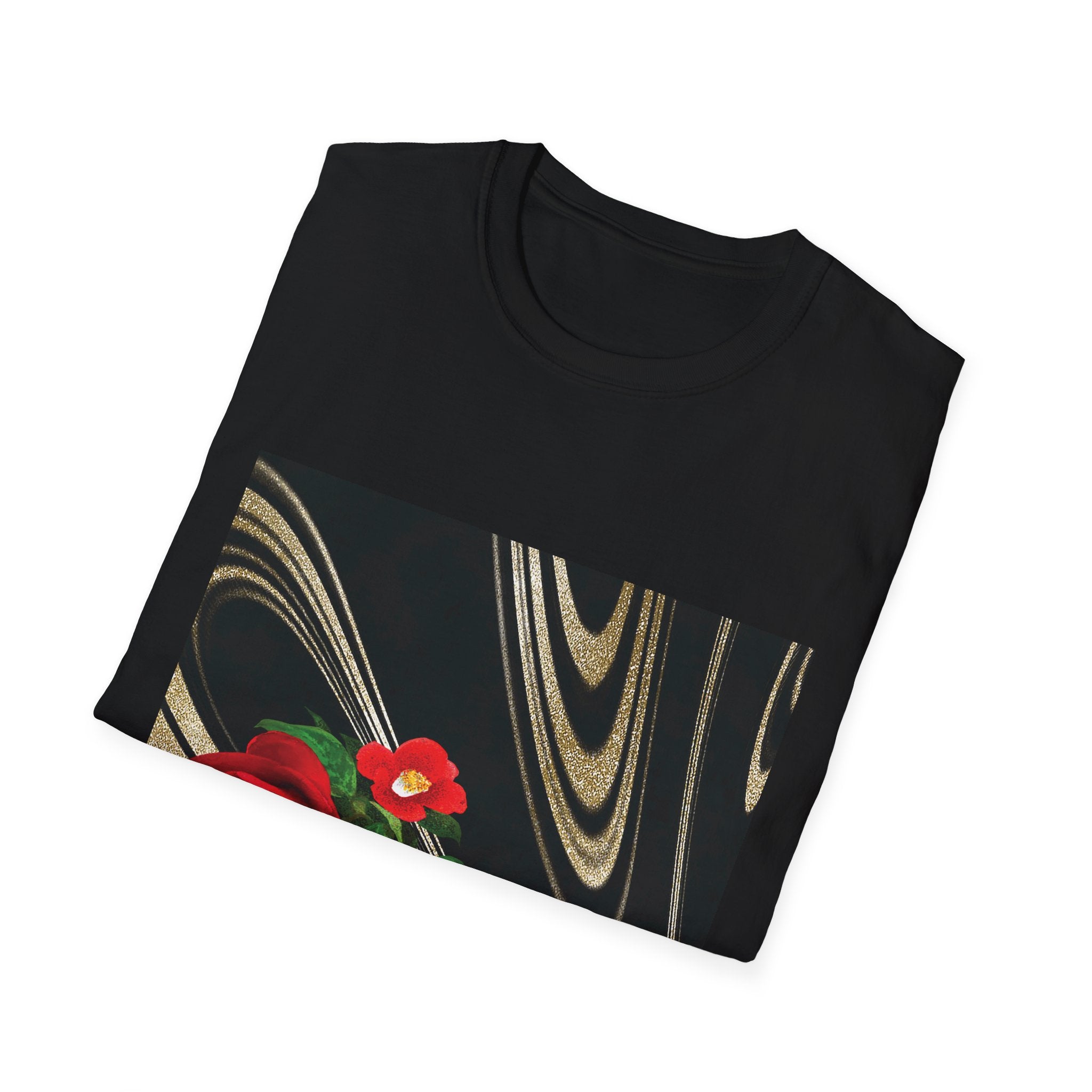 Folded black shirt with gold abstract design and red flower on a white background